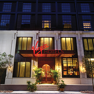 Front view of Virgin Hotels building at night